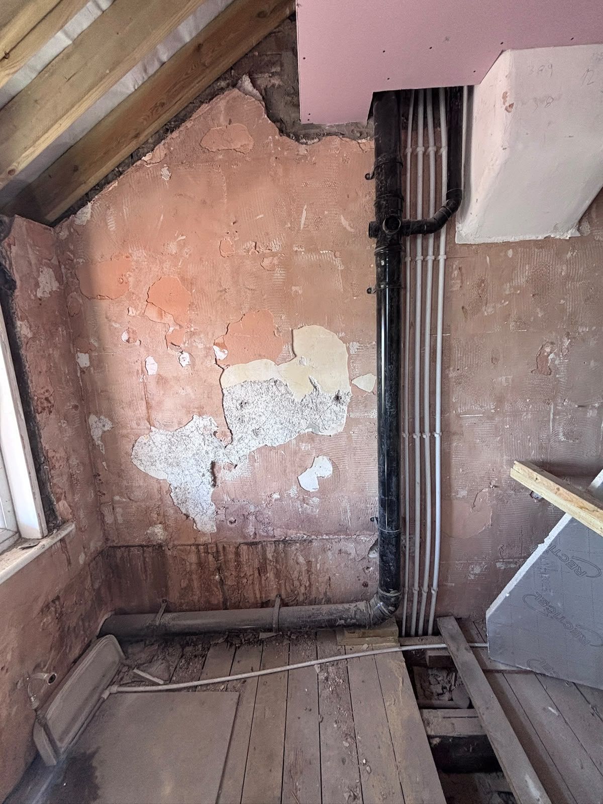 Loft space stripped back to joists and purlins with old plaster removed, Friern Barnet N11
