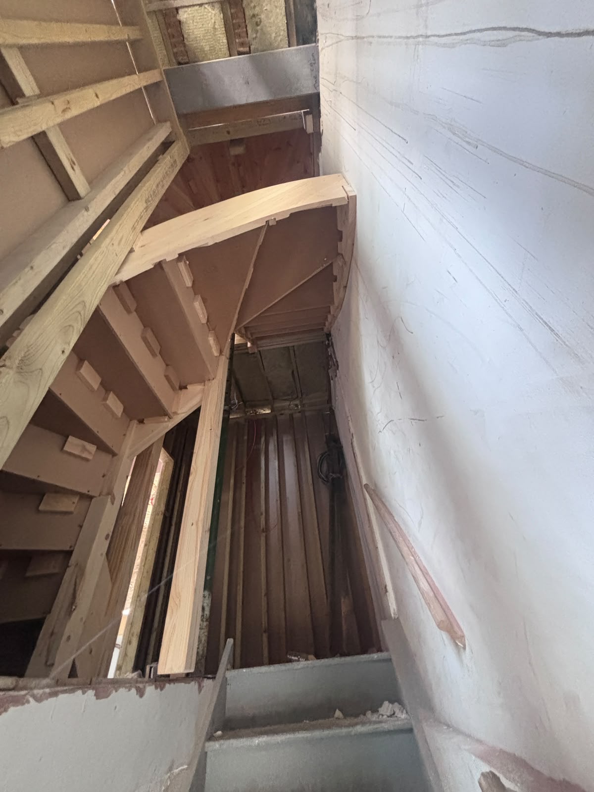 New wooden staircase to the loft under construction during the Friern Barnet dormer loft conversion
