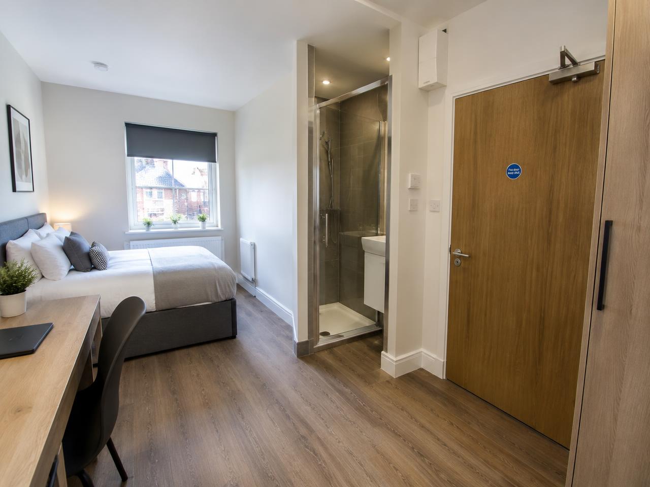 HMO letting room with compact en-suite shower pod, fire door and acoustic flooring